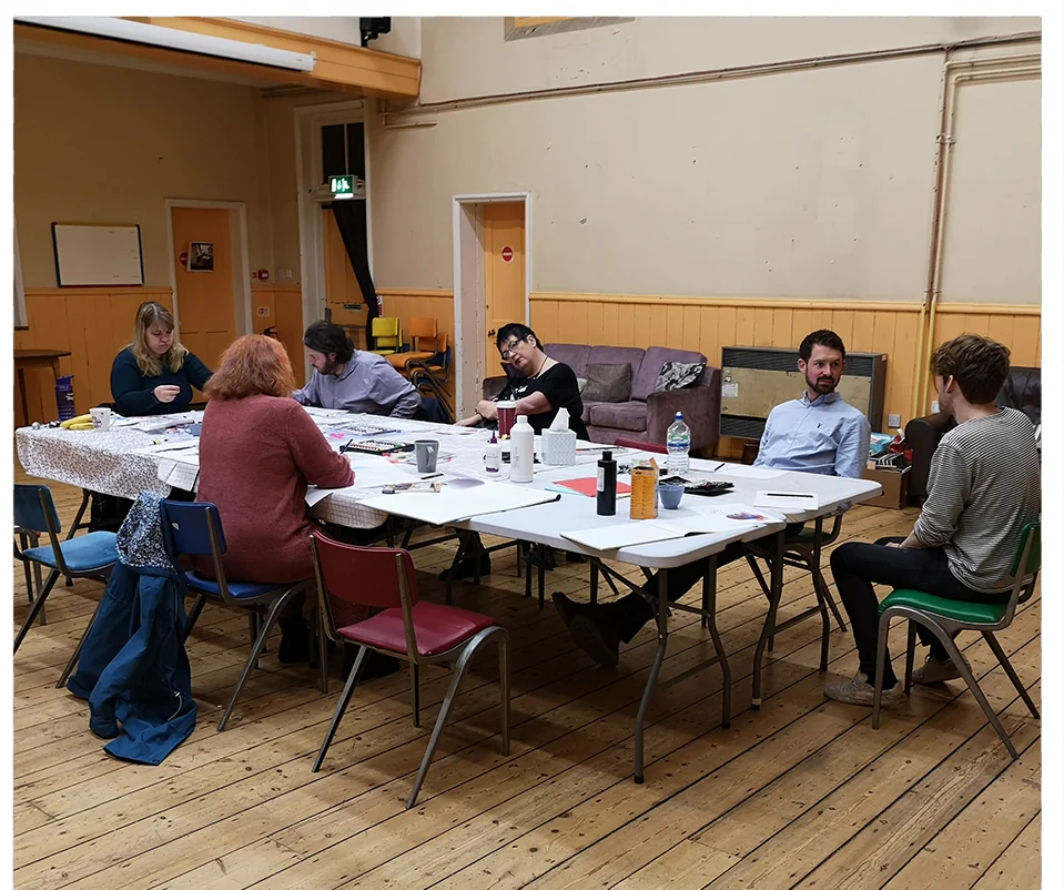 An art class around a long table at the Silver Road Community Centre
