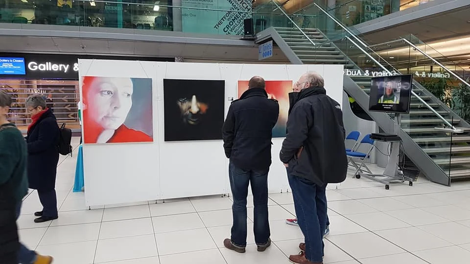 Visitors among the panels