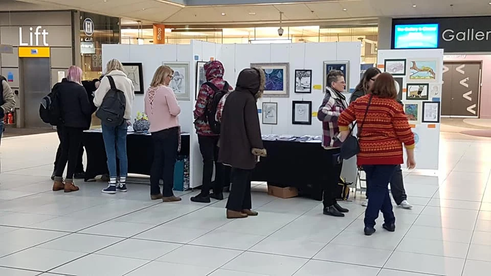 Visitors at the Rethink Mental Illness stand