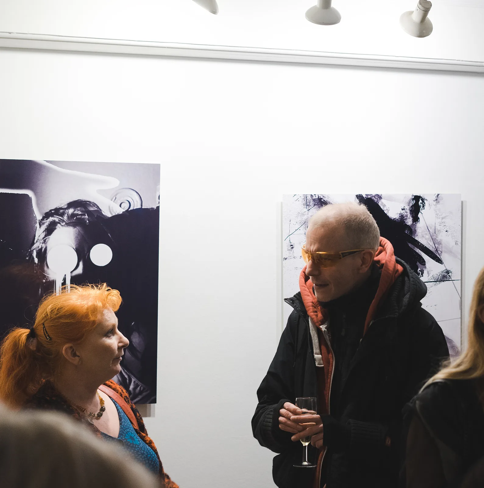 Visitors among the works at the opening