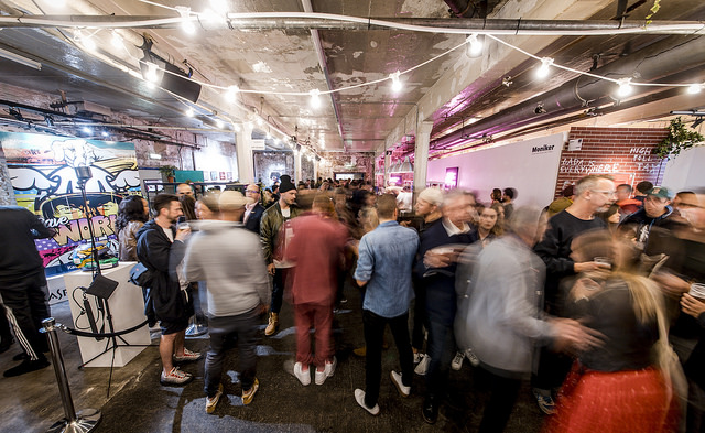 Visitors moving through Moniker Art Fair, photographed by Sam Roberts