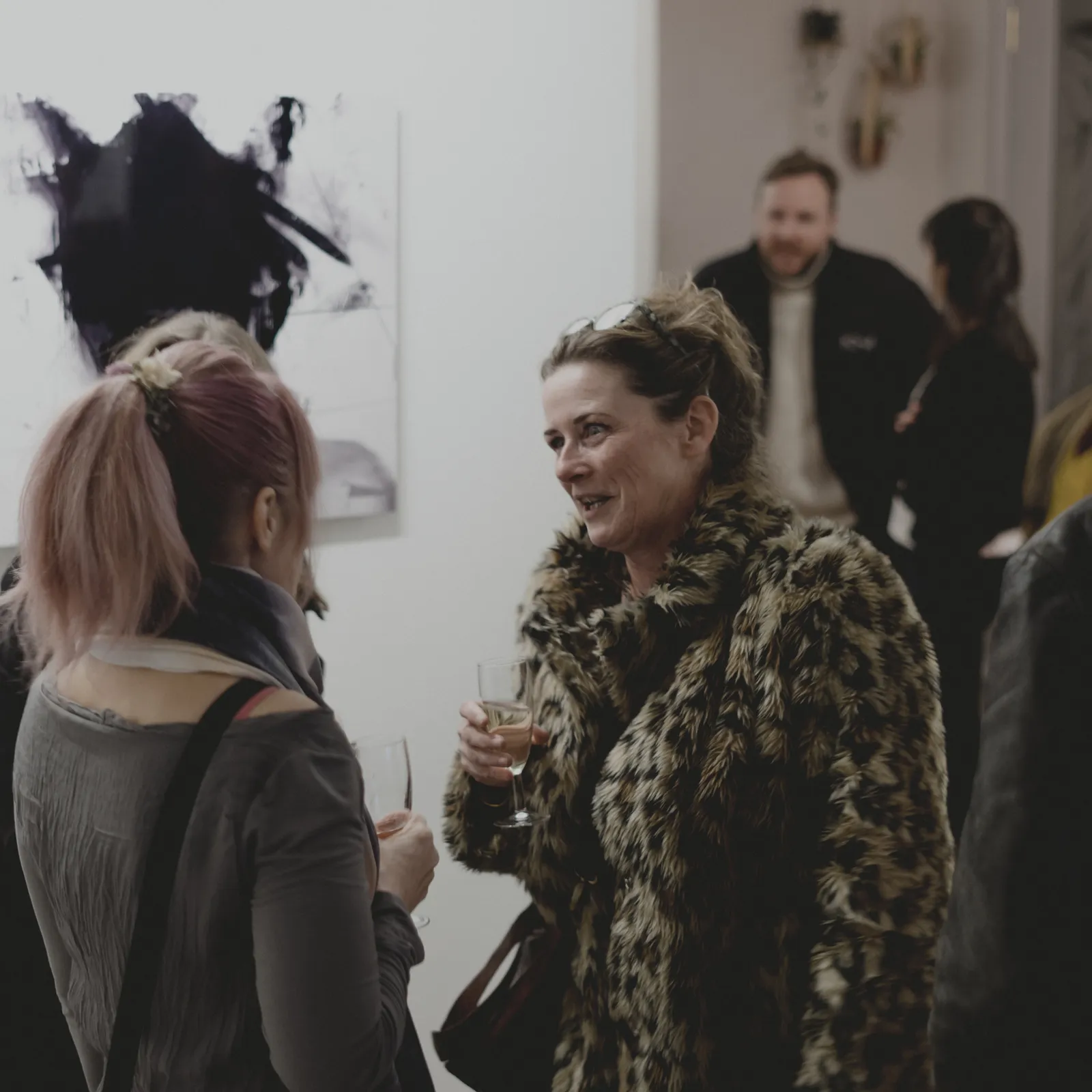 Visitors at the opening of The Weight of Silence, Fairhurst Gallery