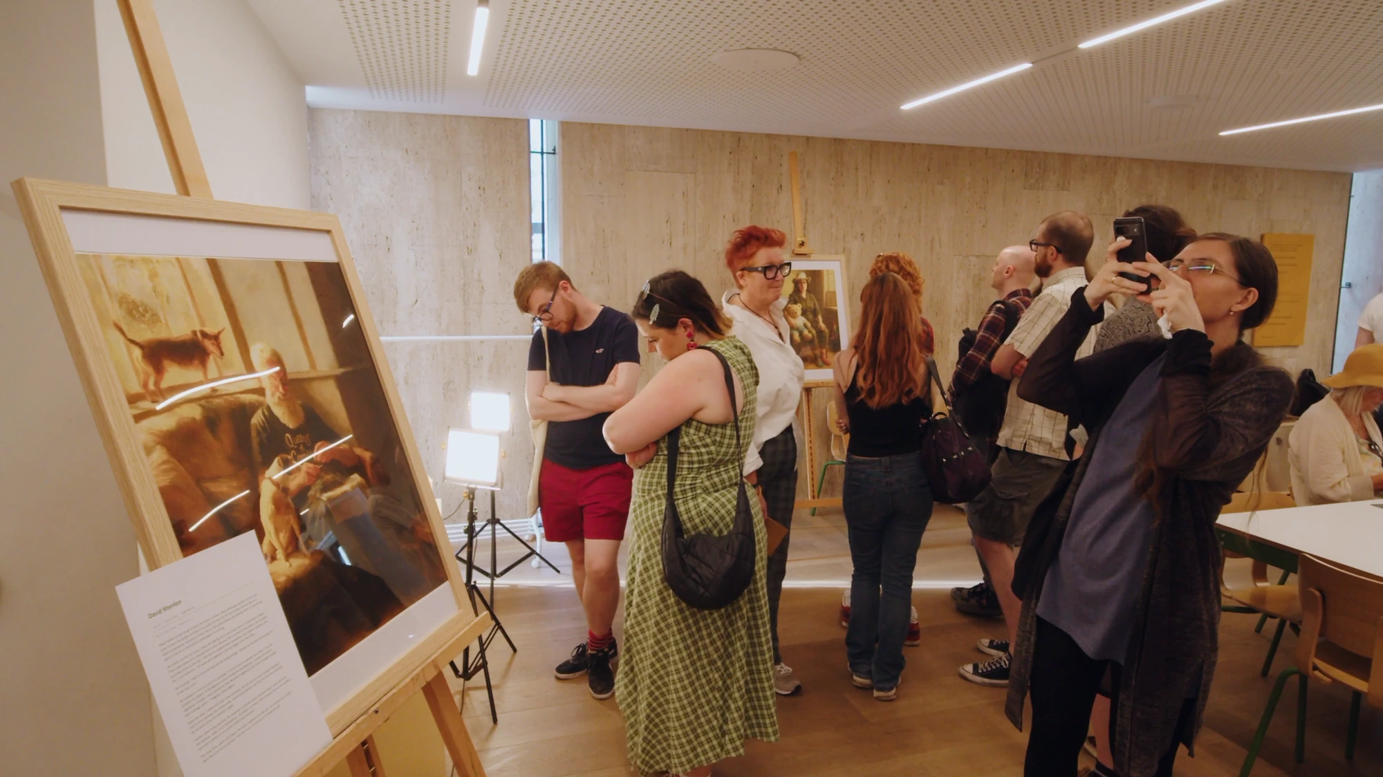 Visitors with works from the Ordinary series in the Roden Centre for Creative Learning